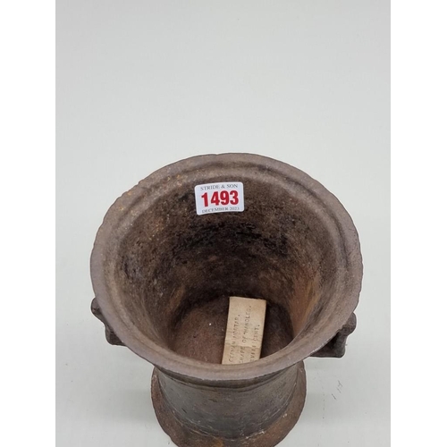 1493 - An antique cast iron mortar, probably German 17th/18th century, 19cm high.