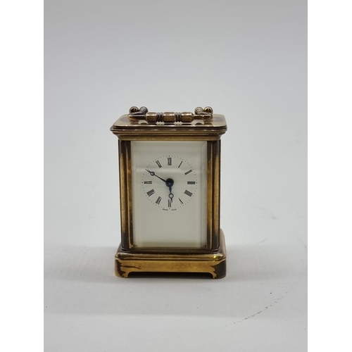 1524 - A miniature antique brass carriage timepiece, height including handle 7.8cm, with original winding k... 