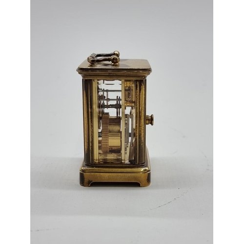 1524 - A miniature antique brass carriage timepiece, height including handle 7.8cm, with original winding k... 