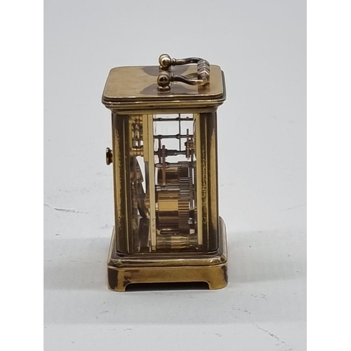 1524 - A miniature antique brass carriage timepiece, height including handle 7.8cm, with original winding k... 