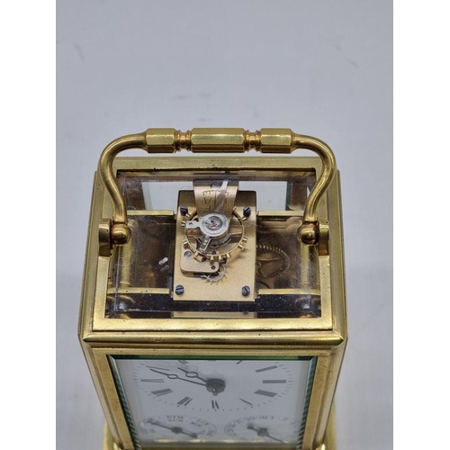 1526 - A good 19th century French brass calendar carriage clock, with subsidiary dials for date and da... 