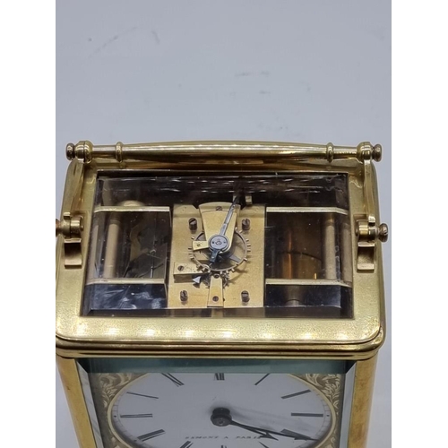 1528 - A good and large 19th century French brass carriage clock, the enamel circular dial inscribed 'Osmon... 