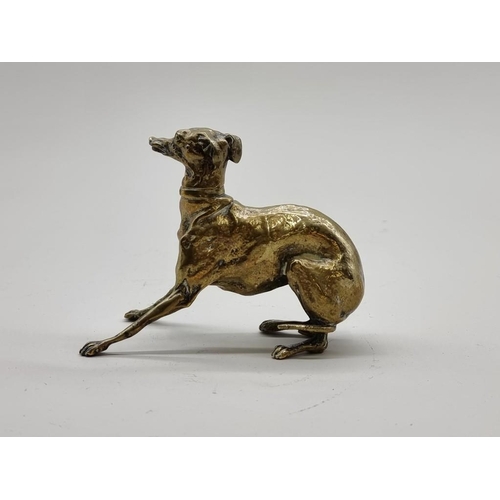 1532 - A small polished bronze whippet, 9.5cm high.