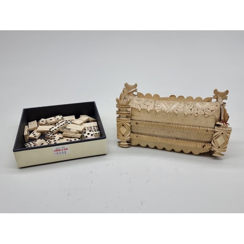 1533 - A Napoleonic prisoner-of-war carved bone sarcophagus form domino box, the inner cover of pierced cri... 