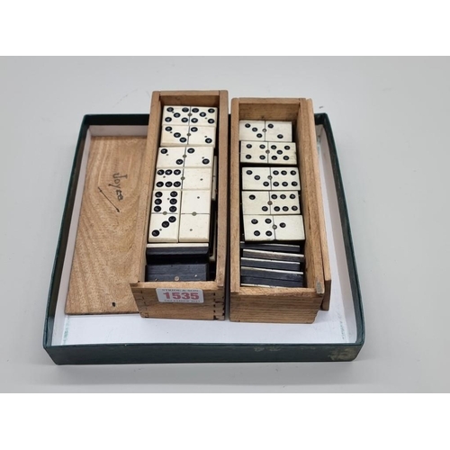 1535 - Two boxed sets of bone and ebony dominoes, (one incomplete). 