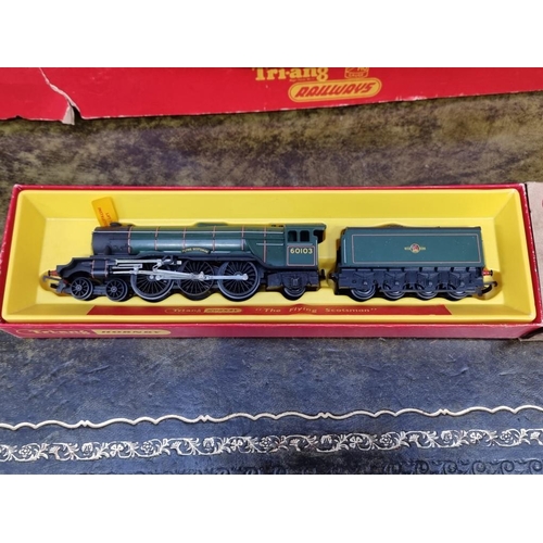 1593 - Four Tri-ang OO gauge railway sets, comprising: RS.3; RS.4; RS.5; and R3L, each boxed; together... 