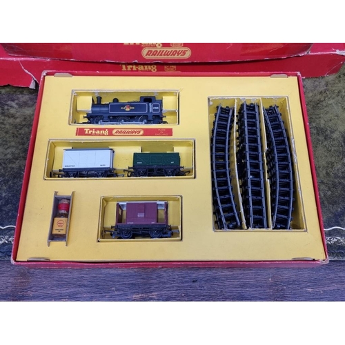 1593 - Four Tri-ang OO gauge railway sets, comprising: RS.3; RS.4; RS.5; and R3L, each boxed; together... 