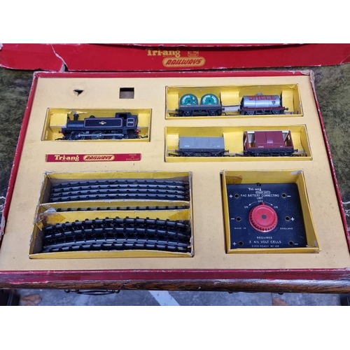 1593 - Four Tri-ang OO gauge railway sets, comprising: RS.3; RS.4; RS.5; and R3L, each boxed; together... 