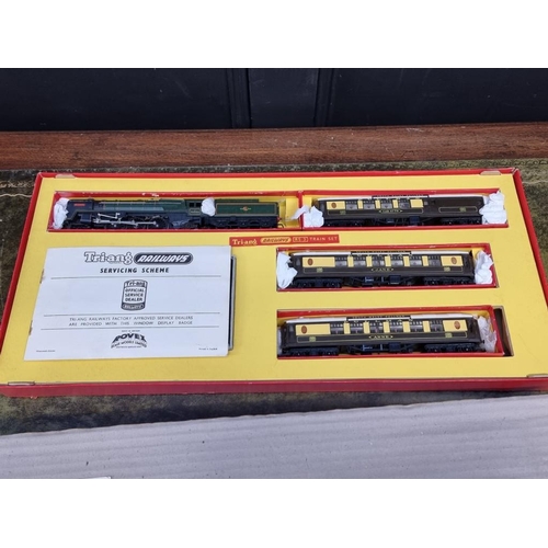 1593 - Four Tri-ang OO gauge railway sets, comprising: RS.3; RS.4; RS.5; and R3L, each boxed; together... 