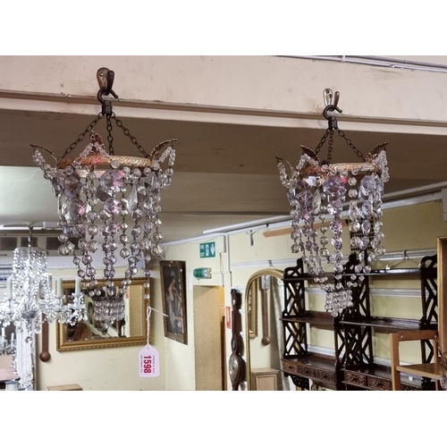 1598 - A small pair of brass and faceted glass chandeliers, approx 34cm high. 