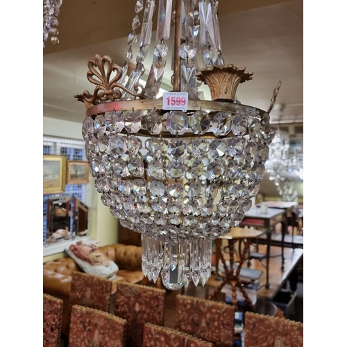 1599 - A good faceted glass chandelier, 75cm high. 