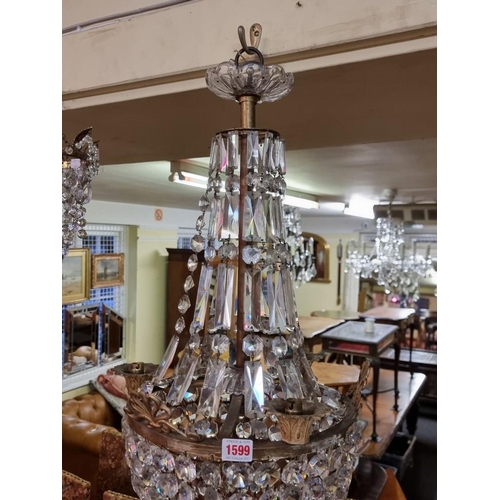 1599 - A good faceted glass chandelier, 75cm high. 