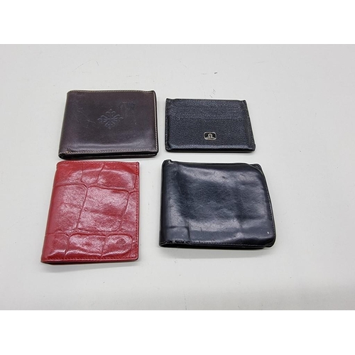 1604 - Four leather wallets, to include examples by: Patek Philippe; Launer; and Mulberry. (4)... 