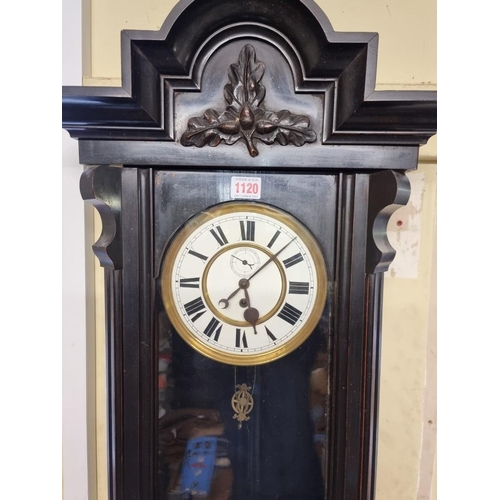 1120 - A late 19th century Vienna style ebonized wall clock, with enamel dial, 107cm high, with pendul... 