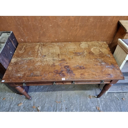 1125 - A late Victorian mahogany two drawer side table, 122cm wide.