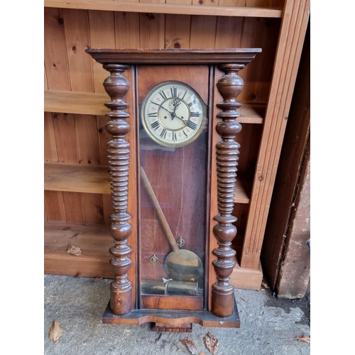 1135 - A late 19th century Vienna style walnut wall clock, 94cm high, with pendulum and weights, (lack... 