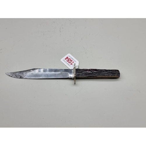 1654 - An antique Bowie knife, the 15cm blade stamped 'R D Melhuish Ltd, Holborn E.C', with stag antler sca... 