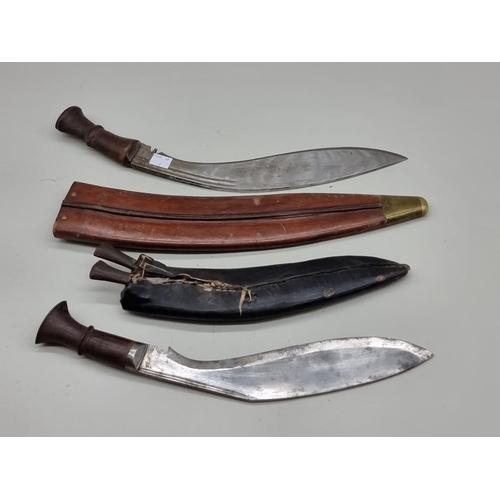 1656 - Two kukris and leather sheaths.