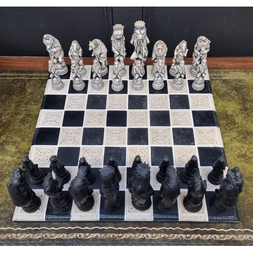 1678 - A large resin chess set, king 19cm, pawn 10.7cm; together with similar 55cm chessboard.... 