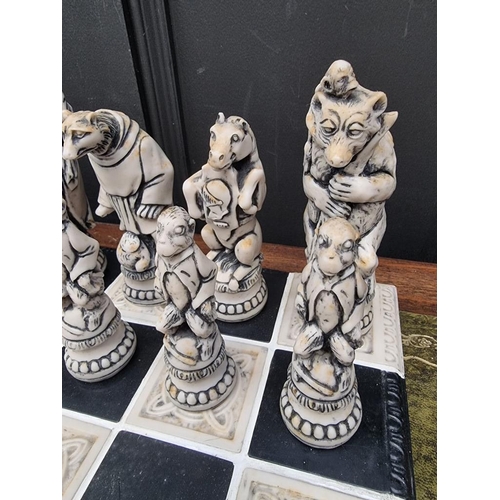 1678 - A large resin chess set, king 19cm, pawn 10.7cm; together with similar 55cm chessboard.... 