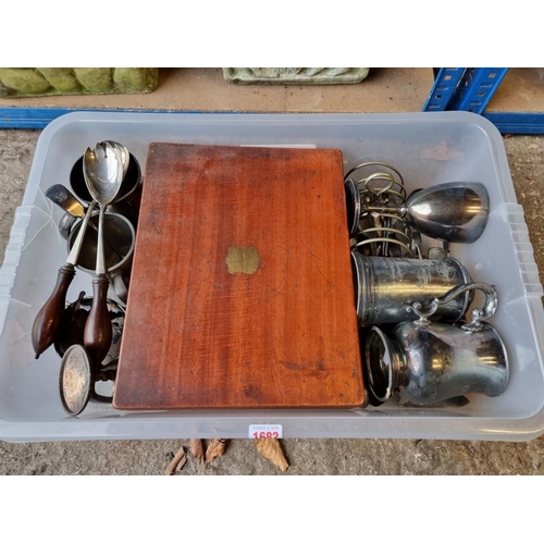 1682 - A large collection of silver plate, to include: an oak cased part canteen, and rowing cups.... 