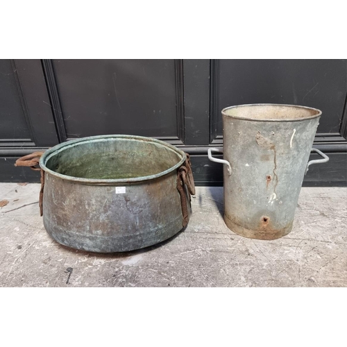 1688 - A large copper twin handled vessel, 42cm diameter; together with a galvanised twin handled buck... 