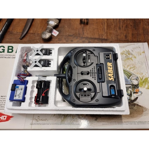 1440A - A boxed Kyosho MGB MK1 radio controlled model car, unmade kit, with remote control.