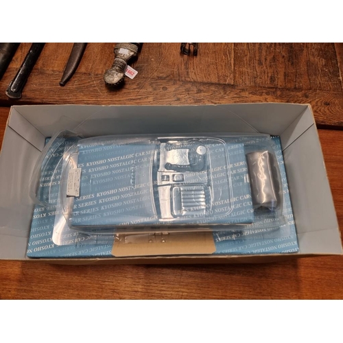 1440A - A boxed Kyosho MGB MK1 radio controlled model car, unmade kit, with remote control.