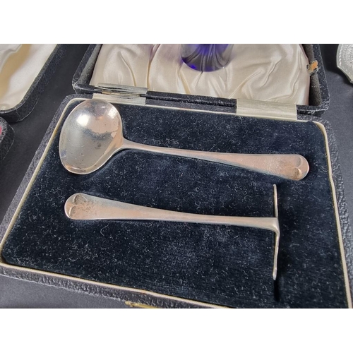 102 - A cased silver child's spoon and pusher; together with a quantity of silver cutlery; a silver mounte... 