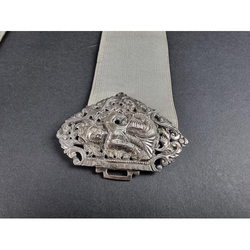 128 - A Thai pierced white metal belt buckle, 9.5cm wide.