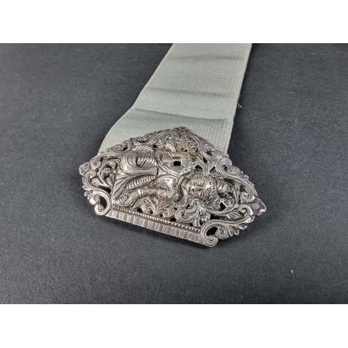 128 - A Thai pierced white metal belt buckle, 9.5cm wide.