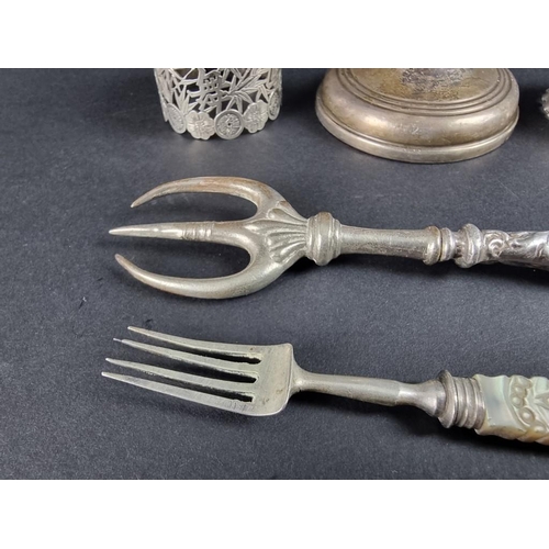 131 - A group of silver and white metal items, to include: a weighted candle holder, by W I Broadway &... 