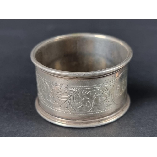 134 - A small group of silver, comprising two small twin handled trophy cups; a pair of silver napkin ring... 