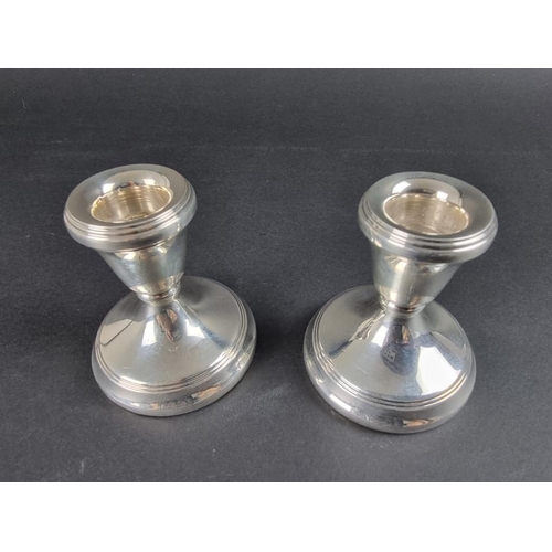 139 - A pair of silver candlesticks, by L J Millington, Birmingham 1995, 7cm high.