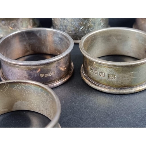 140 - Six similar silver napkin rings; together with two others, 131g. (8)