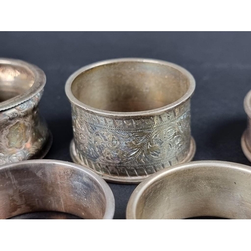 140 - Six similar silver napkin rings; together with two others, 131g. (8)