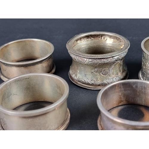 140 - Six similar silver napkin rings; together with two others, 131g. (8)