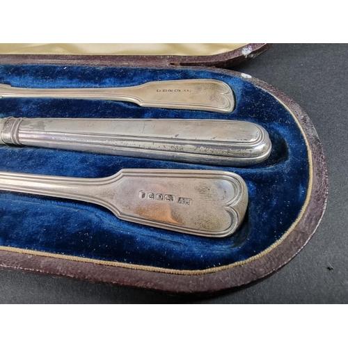 147 - A cased silver fiddle and thread pattern Christening knife, fork and spoon, by Aaron Hadfield, Sheff... 