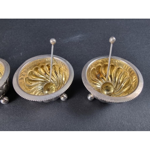 148 - A cased set of four Victorian silver salts with matching spoons, by Harwood, Plante & Harrison, ... 