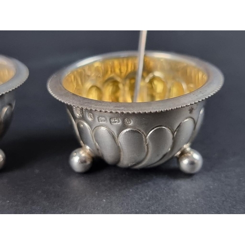 148 - A cased set of four Victorian silver salts with matching spoons, by Harwood, Plante & Harrison, ... 