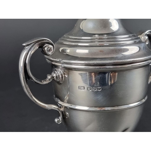 164 - A silver twin handled golfing trophy cup, by Atkin Brothers, Sheffield 1938, 14cm high, on socle, 27... 