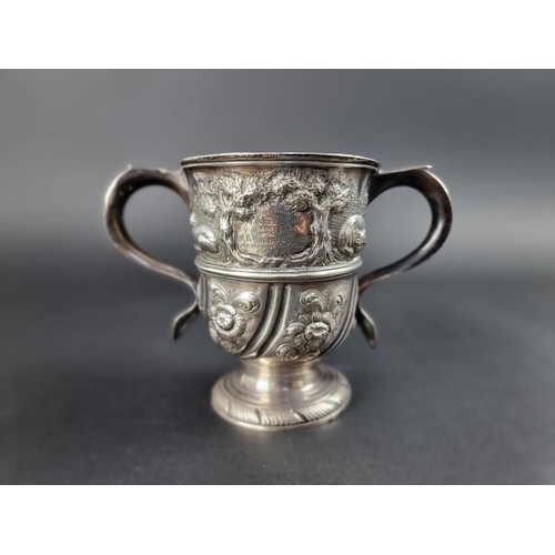 170 - A George II silver twin handled cup, by Benjamin Cartwright I, London 1757, later embossed, 12cm hig... 