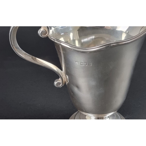 171 - An Edwardian silver jug, by Holland, Aldwinckle & Slater, London 1904, 16cm high, 371g.... 