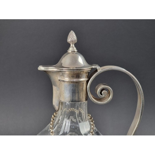 182 - A silver mounted cut glass claret jug, by Edward Barnard & Sons Ltd, London 1911, 34cm high; tog... 