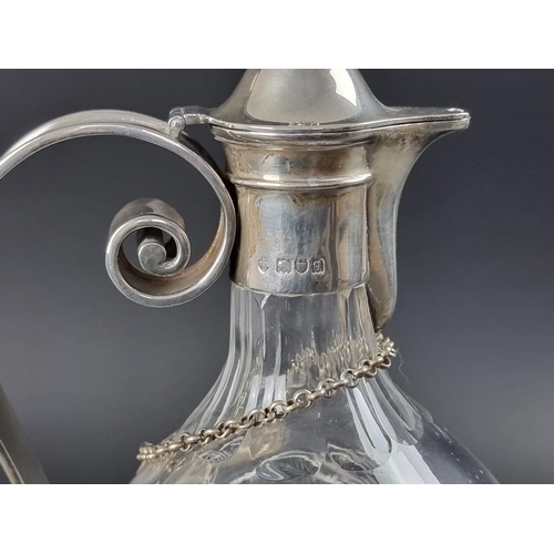 182 - A silver mounted cut glass claret jug, by Edward Barnard & Sons Ltd, London 1911, 34cm high; tog... 