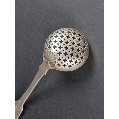 201 - A George III silver fiddle and shell pattern sifter ladle, by William Eley I & William Fearn, Lo... 