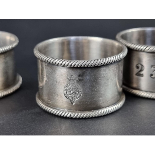 206 - Three Cunard EPNS napkin rings; together with a similar White Star lines example. (4)... 