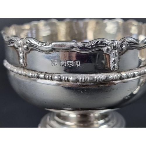 215 - A silver trophy cup, by Cooper Brothers & Sons Ltd, Sheffield 1936, 10.5cm high; together with a... 