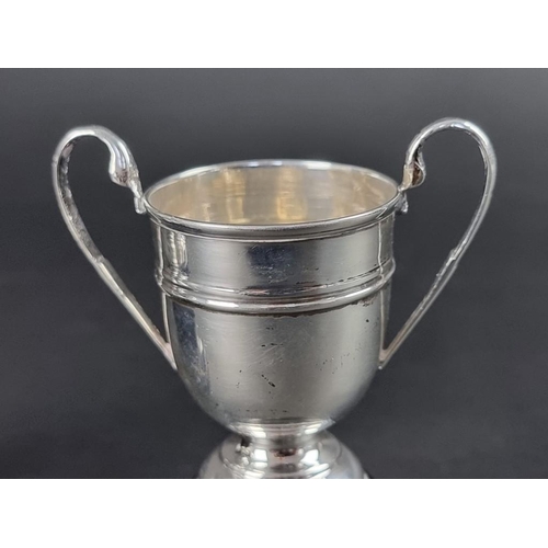 215 - A silver trophy cup, by Cooper Brothers & Sons Ltd, Sheffield 1936, 10.5cm high; together with a... 