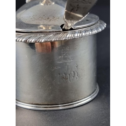 22 - A George III silver gadrooned mustard pot, London 1820, maker's mark rubbed, with an unmatched silve... 